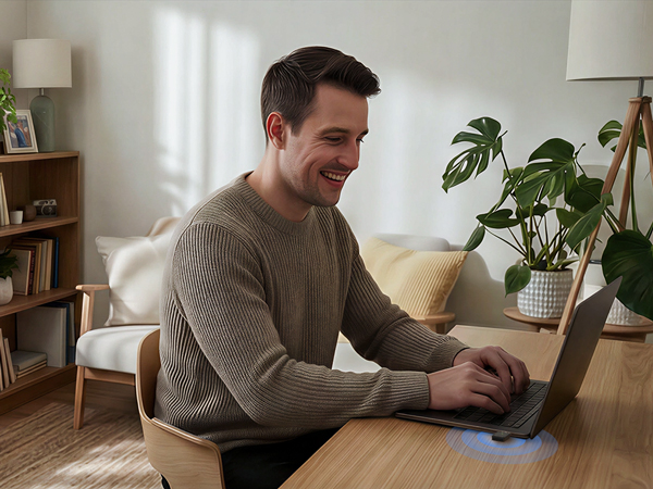 A Man Is Using a Laptop and Enjoying Fast Internet Access with the Linux USB WiFi Adapter
