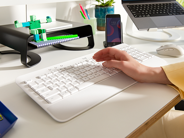 Zoom of hands typing on K650 keyboard in white