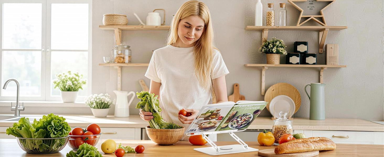 Kitchen scene showing meal preparation with fresh vegetables and ingredients on white countertop, bright natural lighting from windows.