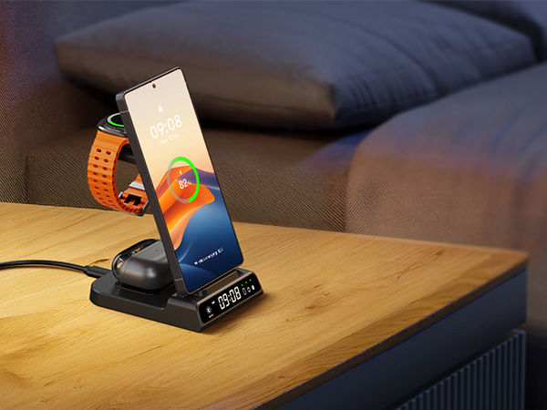 Electronic charging dock on wooden surface showing device being placed and charged. Dark blue fabric visible in background.