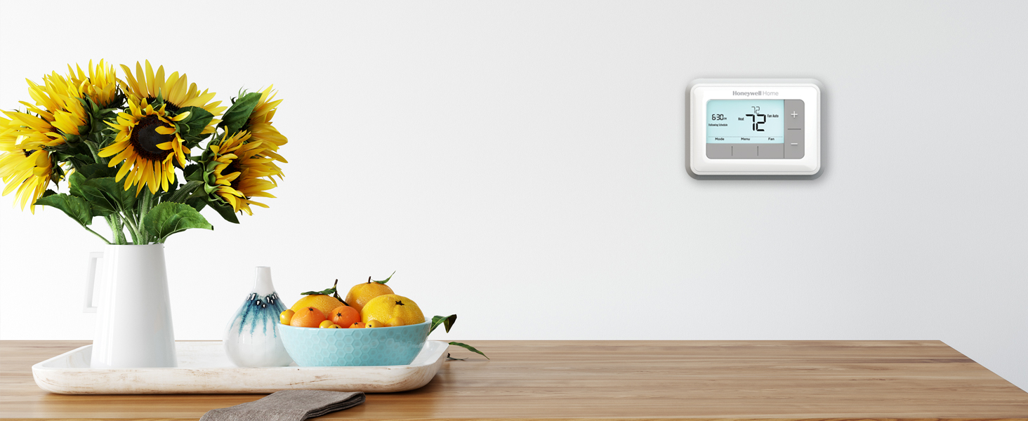 RTH7560E on wall on wall above kitchen table