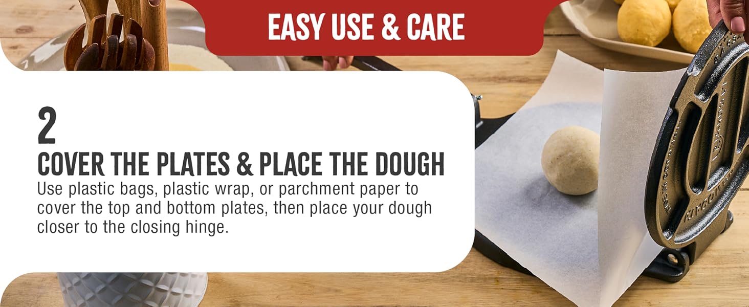 A dough ball on a cast-iron tortilla maker