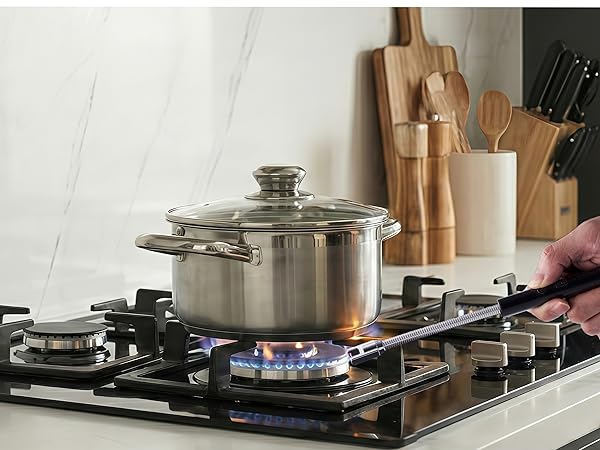 Rechargeable candle lighter with long flexible gooseneck lighting a gas stovetop burner