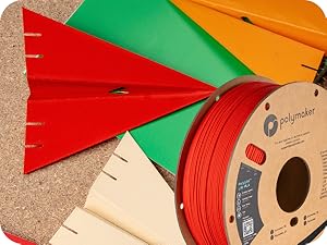 Colorful 3D printed airplanes shown with spool to highlight filament variety and print quality.