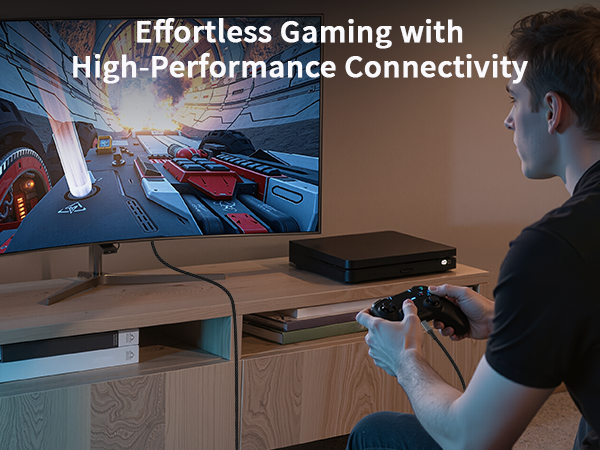 Text reads 'Effortless Gaming with' and 'High Performance Connectivity'. Gaming setup showing computer peripherals and equipment on a desk surface.