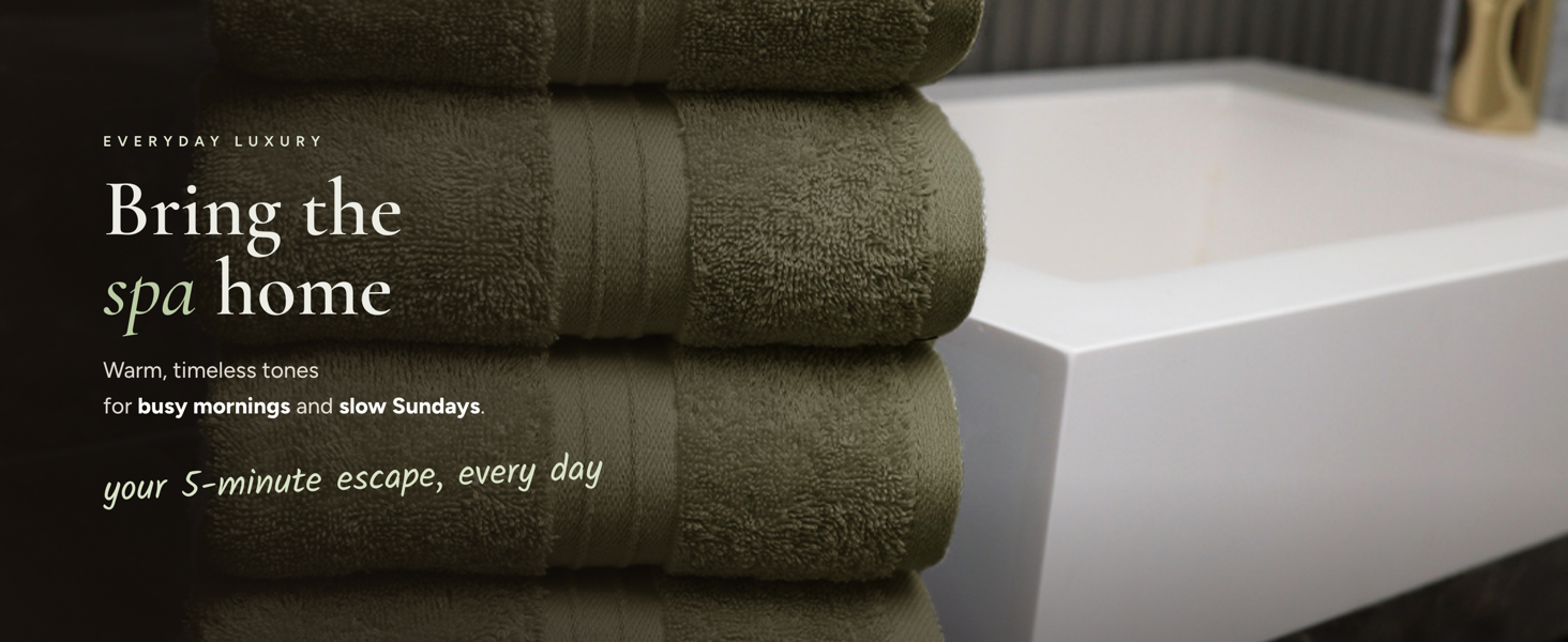 Spa towel feel at home, green bath towels in warm timeless bathroom setting