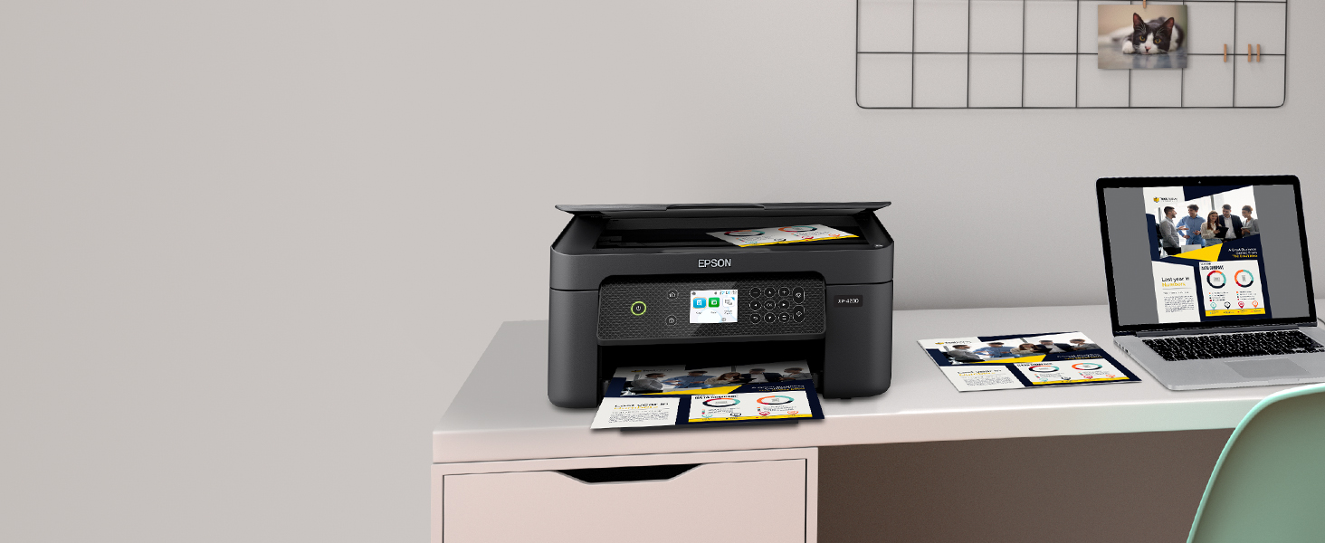 Expression Home XP-4200 printer wirelessly printing from laptop, with document in scanner flatbed.