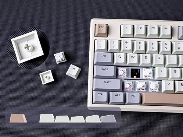 a keyboard with a broken keyboard and a small white cube.