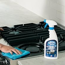 Hand cleaning cooktop with MiracleSpray for Cooktop &amp; Microwave
