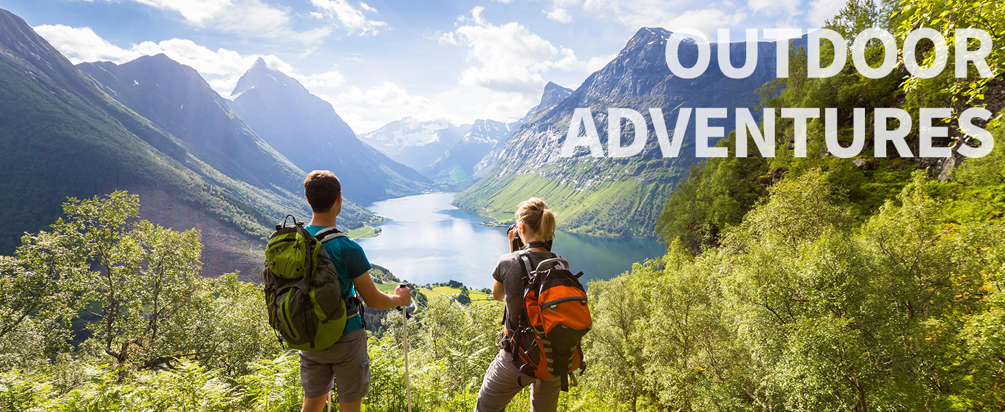 Two hikers with backpacks overlooking a scenic mountain valley with a lake. Text overlay reads 'OUTDOOR ADVENTURES'.