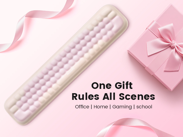Text reads 'One Gift Rules All Scenes'. Pink-themed product images showing white electronic device with pearl-like buttons against pink background with gift bow decorations.