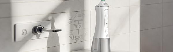 TBPO cordless water flosser on bathroom sink – portable oral irrigator for daily dental care