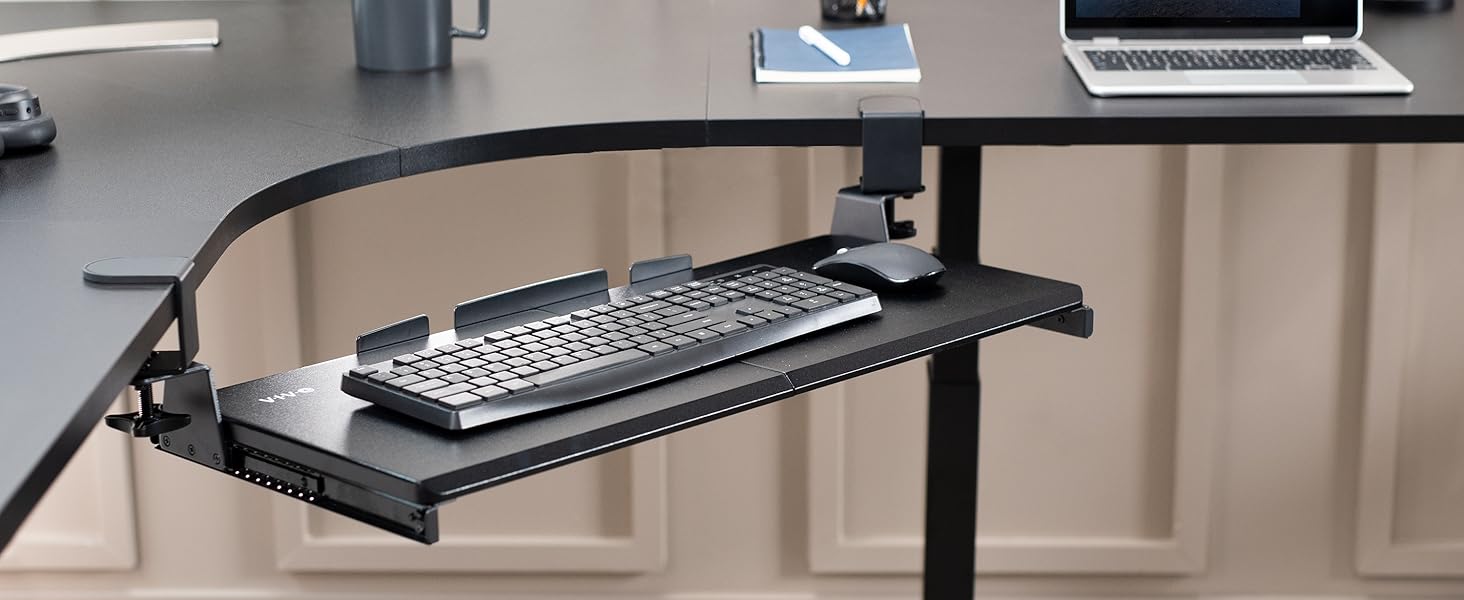 Keyboard tray secured to corner desk with swiveling desk clamps