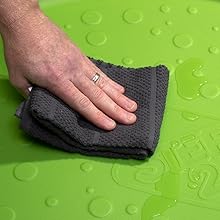 Close up of cloth wiping surface of Splash Pad