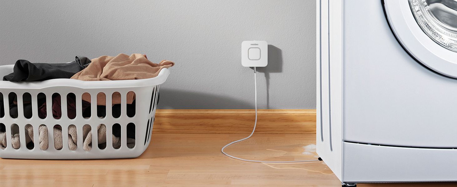 RWD42 Water Leak Detector mounted on wall next to leaking washing machine