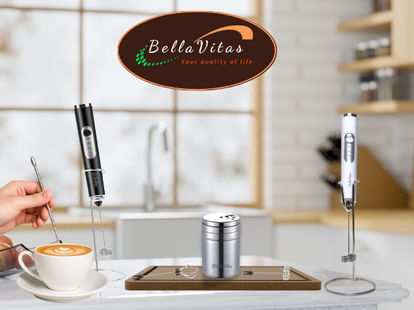 Black and white milk frothers with stainless steel shaker, latte art pen, in a kitchen