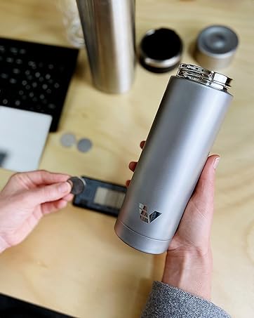 Founder holding Stainless Steel Ever Vessel bottles