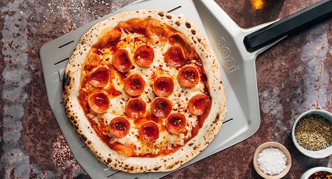 a pepperoni pizza on a pizza pan