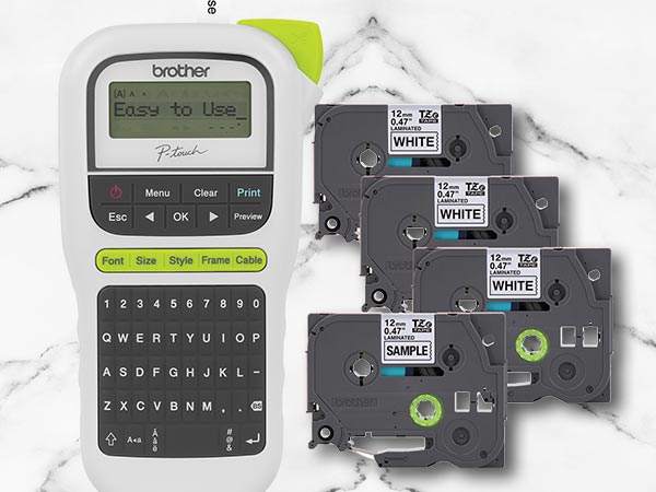 Label maker on marble surface, shown with four included label tapes