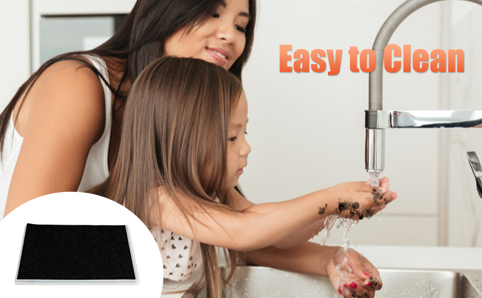 a mother and her daughter washing their hands in the kitchen sink