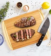 Totally Bamboo Kona Groove Bamboo Wood Cutting Board with sliced steak.