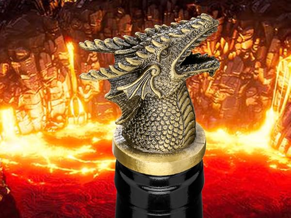 Decorative bronze-colored dragon bottle stopper or cap against fiery background with orange glowing effects.