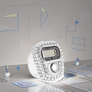 A close-up view of the product resting on a wooden surface, surrounded by golf tees and a few golf b