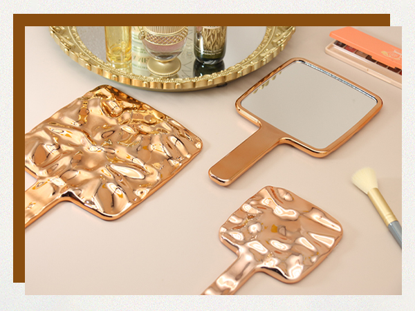 handheld mirror with held