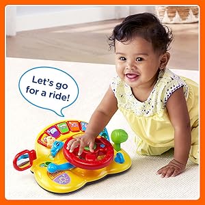 Kid laughs as Turn &amp; Learn Driver says: Let’s go for a ride!