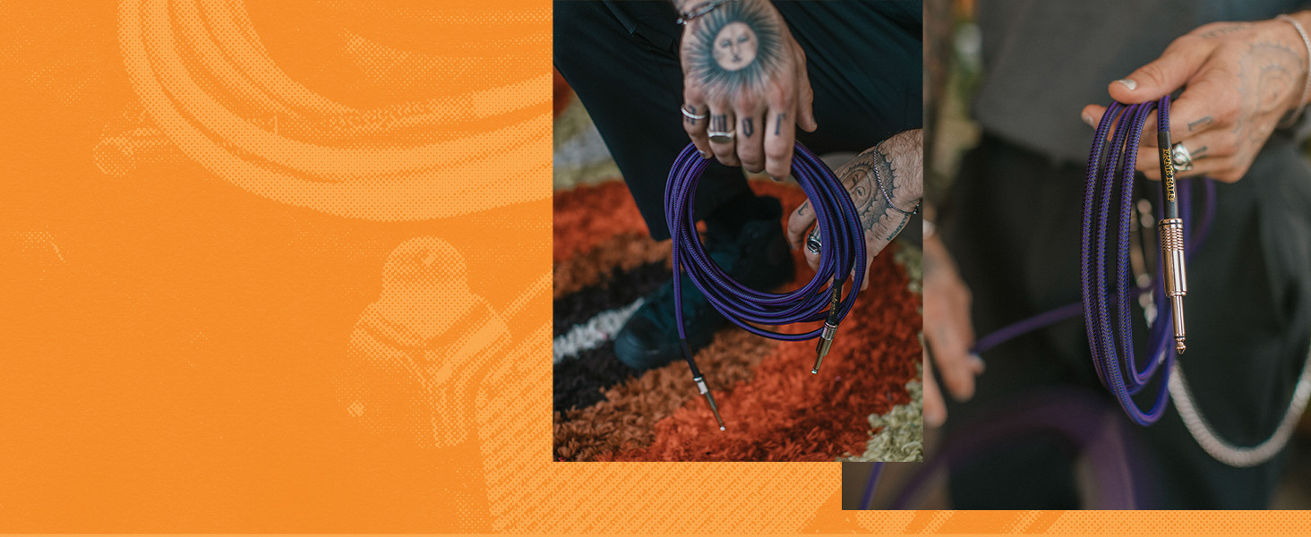 hand holding purple guitar cable