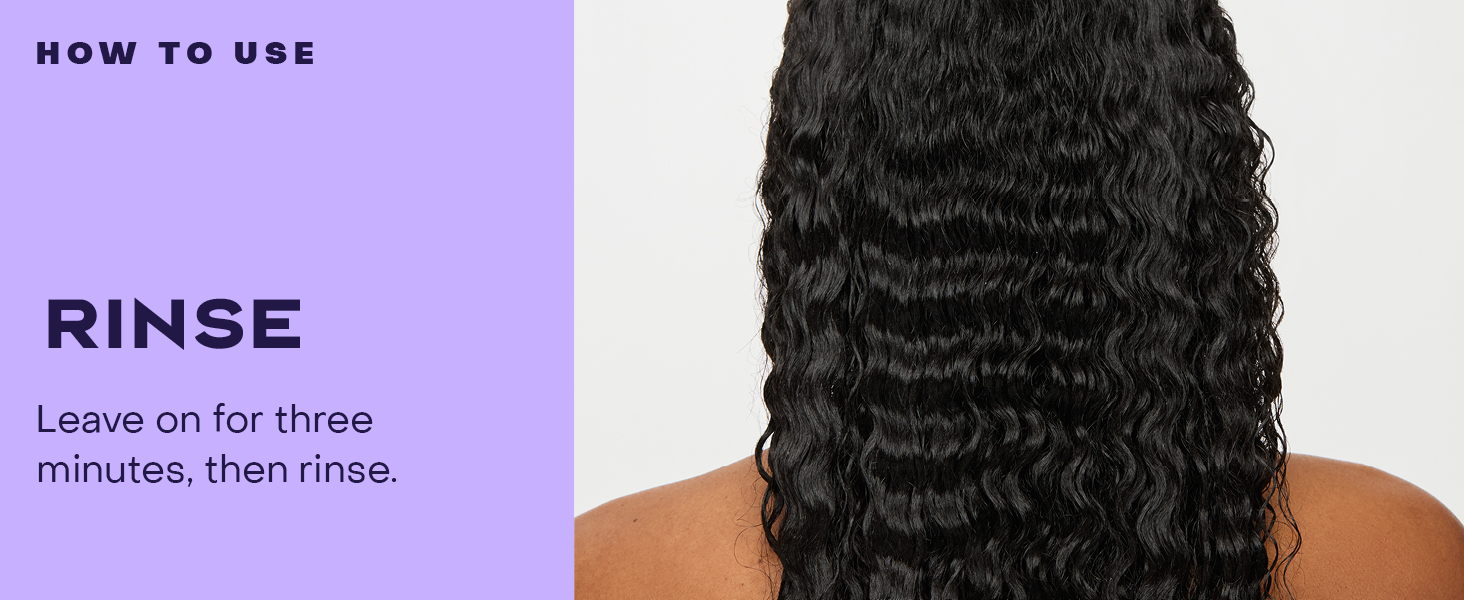 Woman&amp;#39;s back shows long, wavy black hair, emphasizing shine &amp;amp; health.