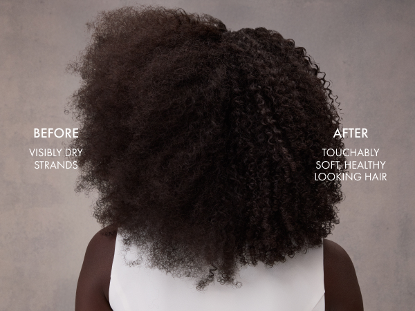 Woman shown from behind with her dark curly hair split to compare before and after shampoo results.
