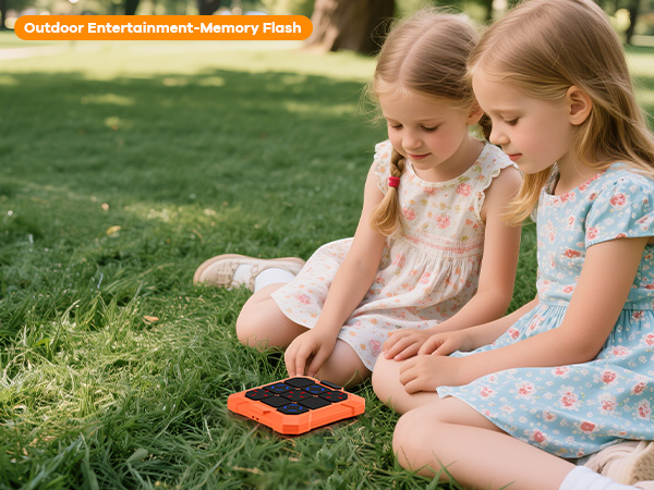 Children sitting outdoors on grass, engaging with what appears to be educational or play materials. Multiple shots show different angles of the interaction.