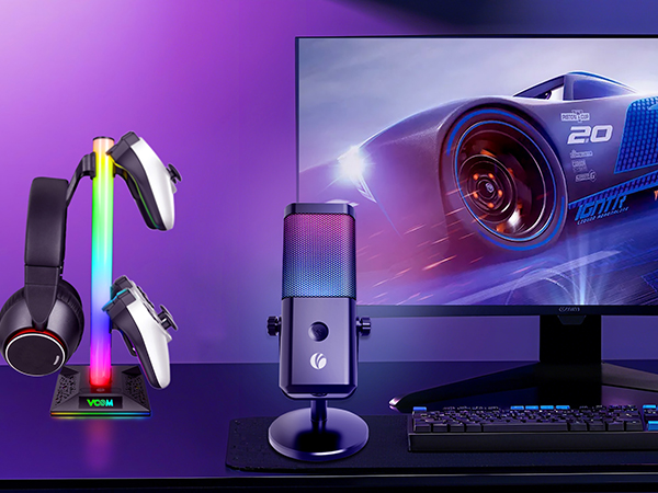 Gaming setup with purple LED lighting showing gaming peripherals including headset, keyboard, and monitor against dramatic backdrop.