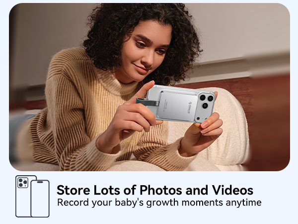 Text reads 'Store Lots of Photos and Videos Record your baby's growth moments anytime'. Multiple connected images showing someone looking at and interacting with a phone while relaxing on furniture.