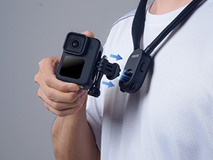 Insert the mounted action camera, rotate it to the right to lock