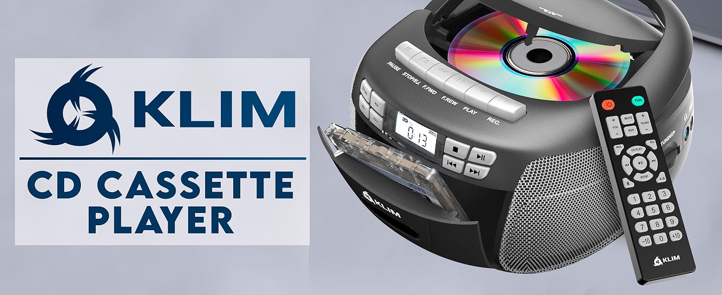 Text reads 'KLIM CD CASSETTE PLAYER'. Portable CD player with digital display, speakers, and remote control shown in dark gray finish.