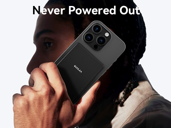 Black smartphone with triple camera setup and large battery section. Device held to ear, showcasing its size and 'Never Powered Out' feature.