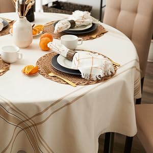 A round table featuring a DII French Stripe tablecloth measuring 70&amp;amp;amp;#34; around