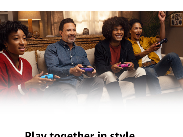 Family on couch playing games holding dualsense wireless controllers