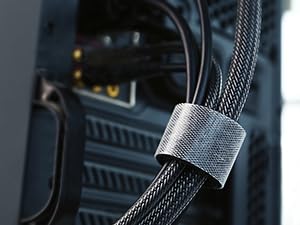 Close-up of a black braided cable with a metal connector or clamp.