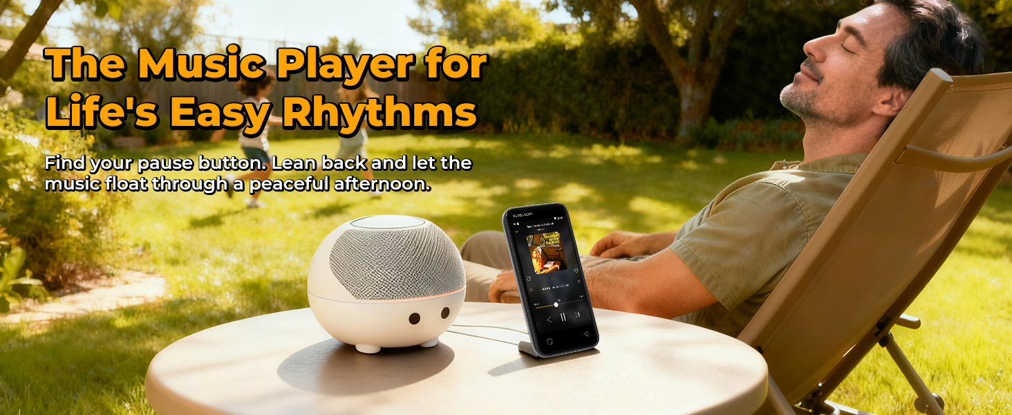 MP3 player on a table with a speaker, while a person relaxes in the yard on a sunny day