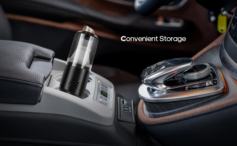 Car interior showing a cup holder with digital display and charging capabilities, installed in center console near gear shifter.