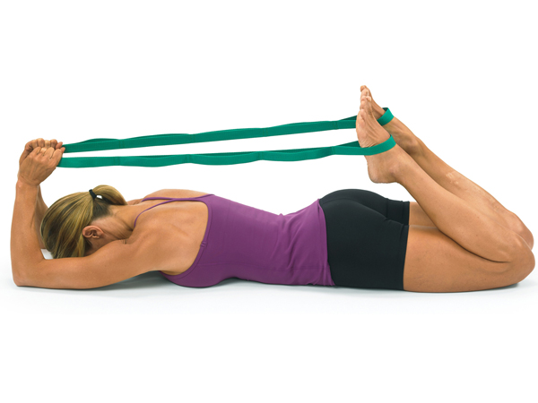 woman stretching both legs simultaneously with stretch out strap
