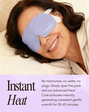 Smiling woman wearing LumiDew self-heating eye mask for instant, consistent warmth.