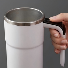 Self stirring coffee cup