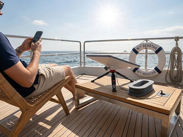 Starlink Mini ethernet cable rack organizer used on a luxury yacht deck table