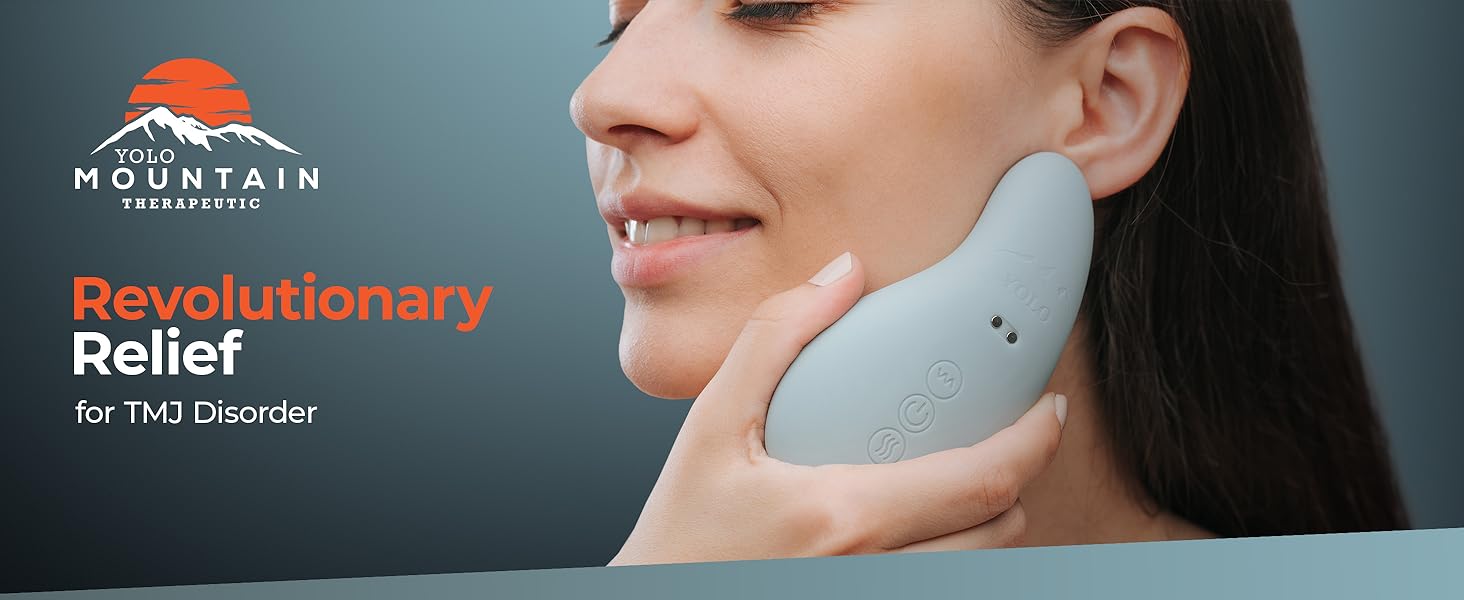 person holding the head massager up to their face