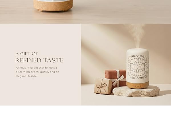 Text reads 'A GIFT OF BEYOND TASTE'. Beige ceramic or porcelain container with lid shown in soft lighting against neutral background.