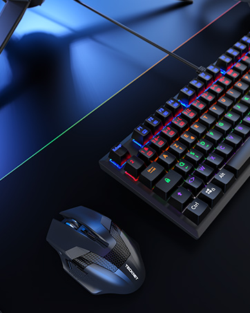 Gaming setup with illuminated mechanical keyboard featuring colorful RGB backlighting and a matching gaming mouse on dark surface.